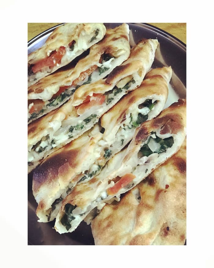 Spinach and cheese pide from Saray Turkish Pizza And Kebab Restaurant