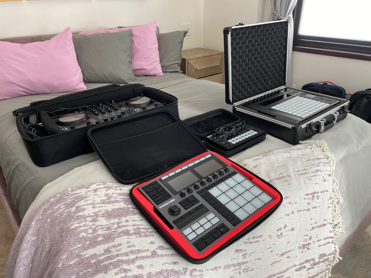 Here are our cases (don't judge the comforter or pillow colors, not our cabin). We used the Mobile Producers Backpack for the Traktor Controller (also works for a variety of gear and can be configured with its removable dividers), The Unison Hard Case holds our Push 2, Pulse Case for our Maschine+ and the Glide Case for the MC-101 by Roland 
