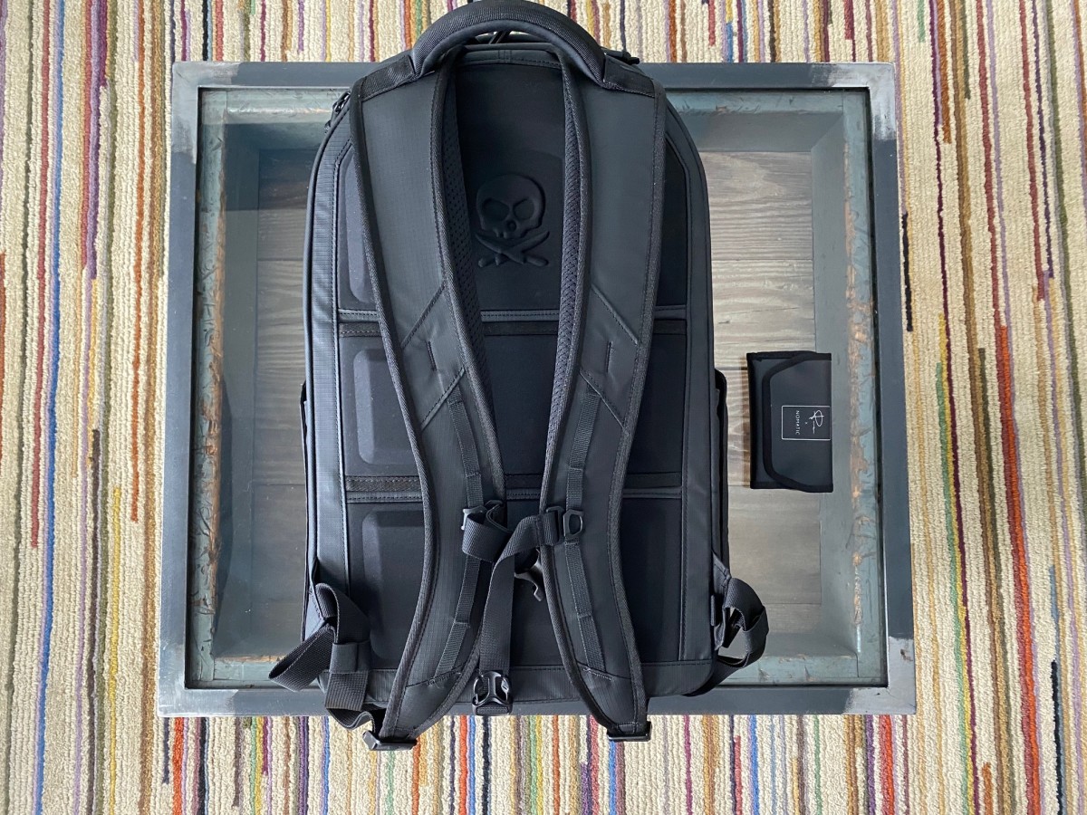 The pack features a luggage loop so you can slide it over roller handles, comfortable straps with a cross support strap for heavy loads, breathable pads for long hauls, and that oh-so-cool McKinnon insignia. 